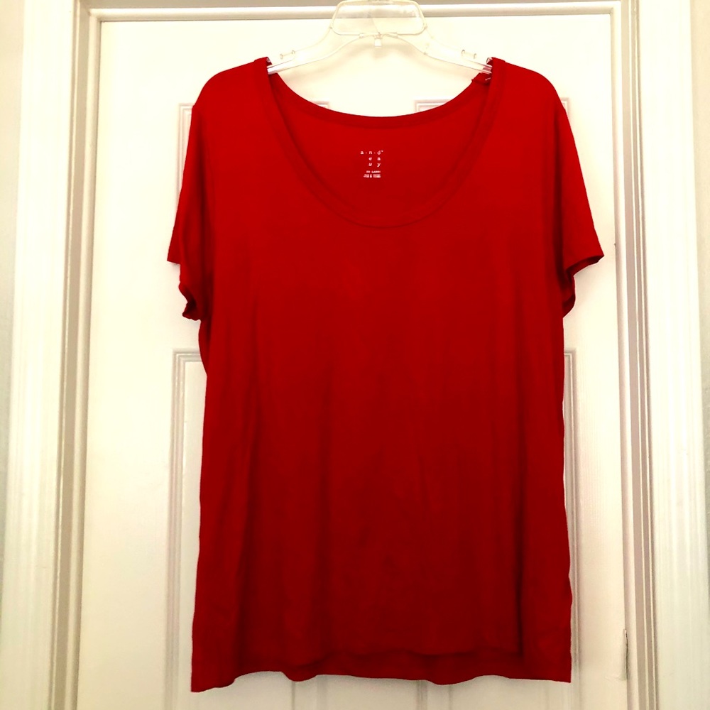 A New Day red shirt.